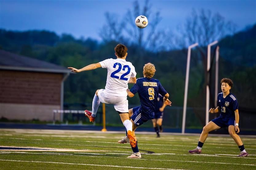 Students play soccer